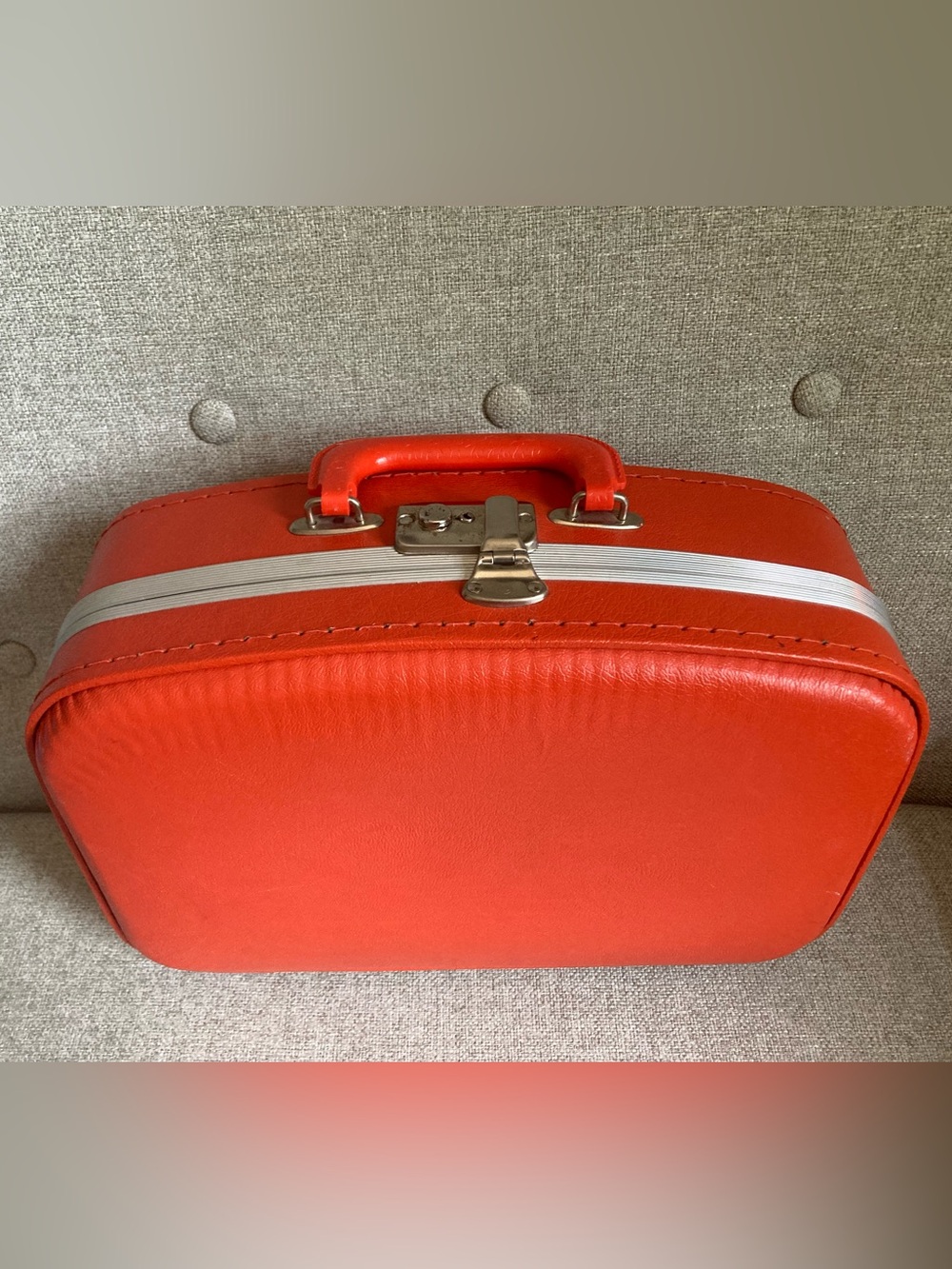 Bright orange vintage luggage